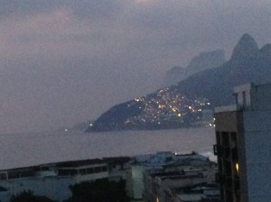 A favela seen at nightfall; this one is right by the beach at Ipanema